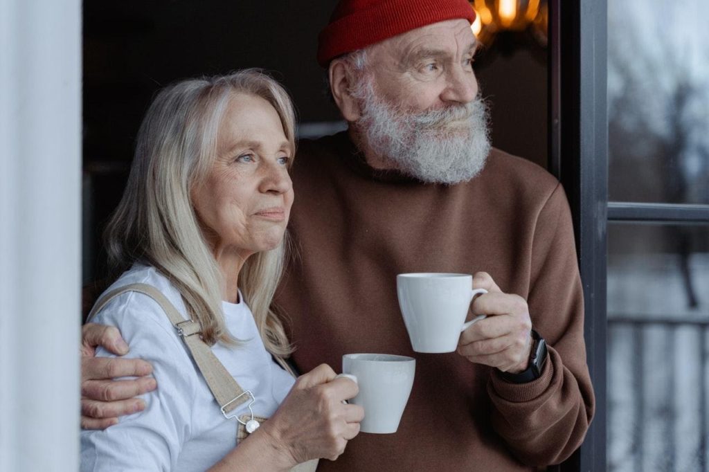 old man and woman drinking coffee